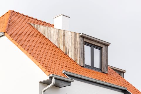 Timber-frame dormer window cladded with barnwood Timber-frame dormer window cladded with barnwood