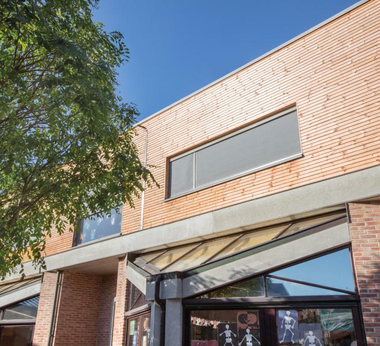 Houten gevelbekleding school Eke