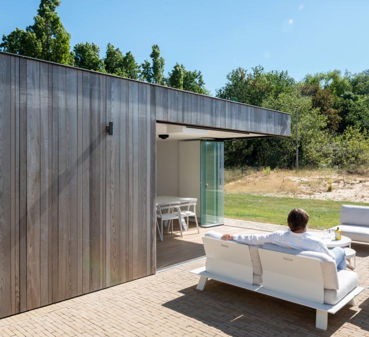 Modern pool house with thermo ash cladding 