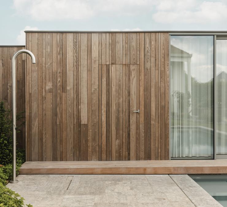 Pool house finished with thermo ash cladding Plus Line QC