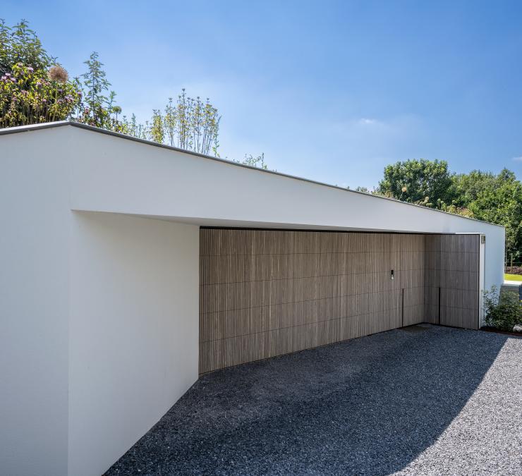 Modern house with a sectional door in pre-weathered HOTwood ash